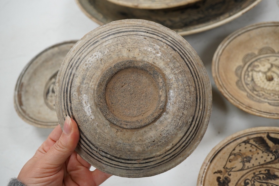 A group of Thai ceramic dishes, possibly Sukothai, largest 36cm